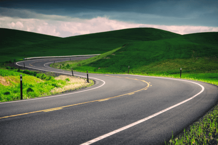 image of a windy desolate road insinuating dangerous curves ahead