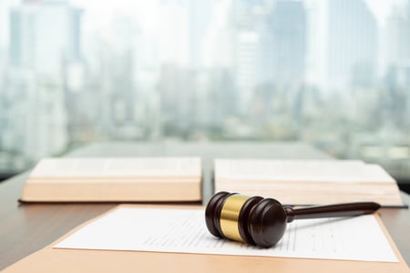 gavel lays atop a piece of paper