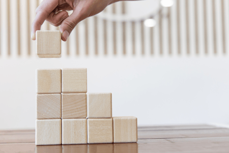 hand stacking blocks